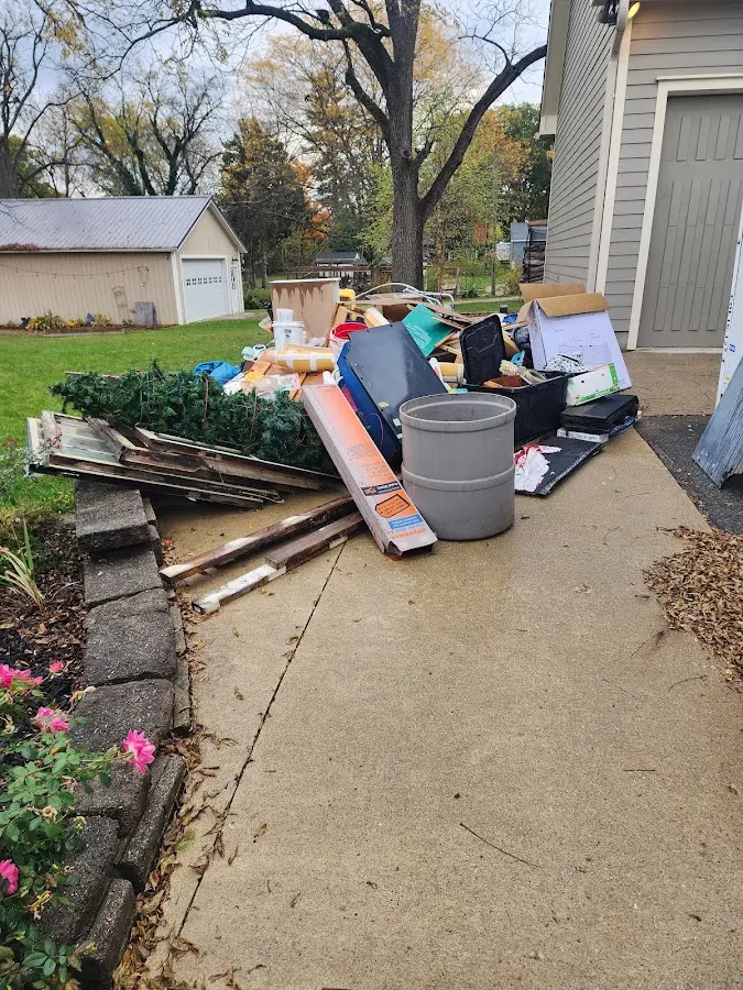 Dumpster being loaded with debris for Demolition Dumpster Rental in Miles City
